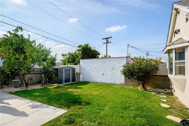 a view of a garden with a house