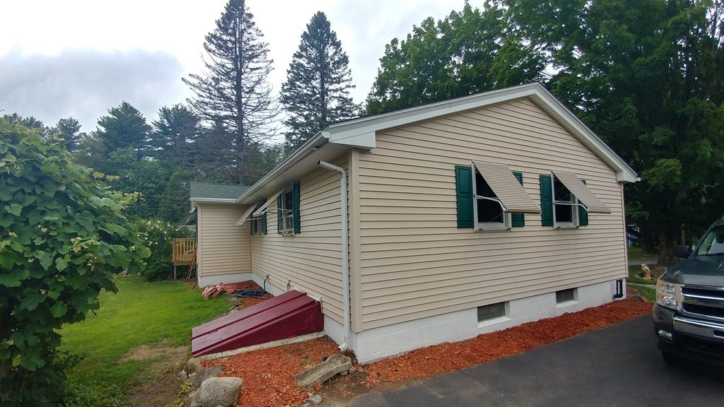185 Chudy Street Three Rivers, MA 01080 - Photo 3 of 16 a view of house that has a yard