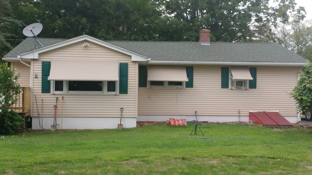 185 Chudy Street Three Rivers, MA 01080 - Photo 4 of 16 a front view of a house with a yard