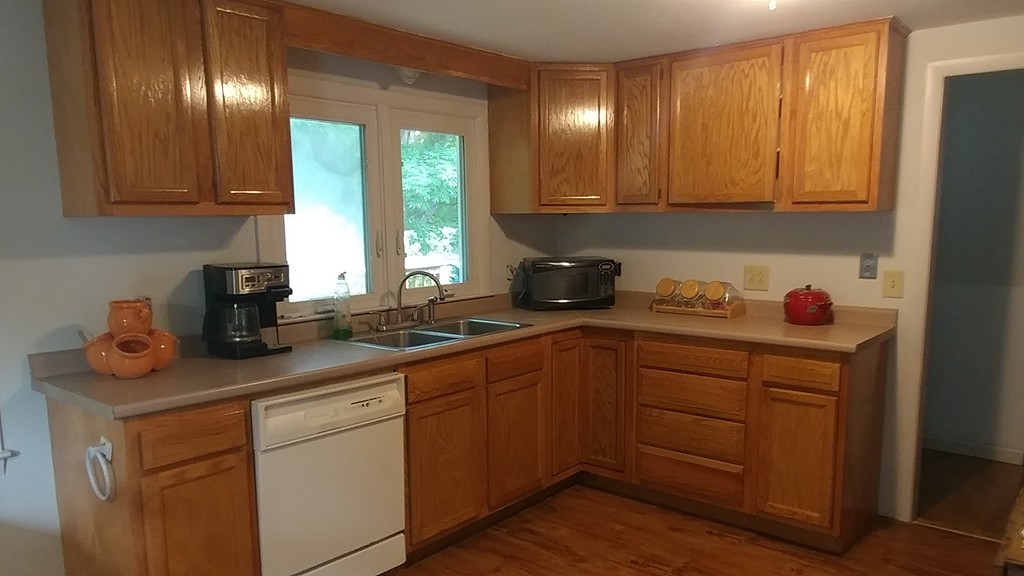 185 Chudy Street Three Rivers, MA 01080 - Photo 10 of 16 a kitchen with stainless steel appliances granite countertop wooden cabinets and a stove