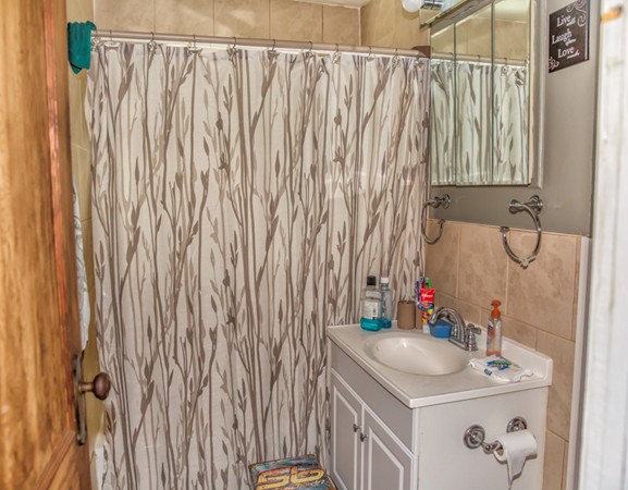 101 Daviston Street Springfield, MA 01108 - Photo 15 of 25 a bathroom with a sink and a mirror