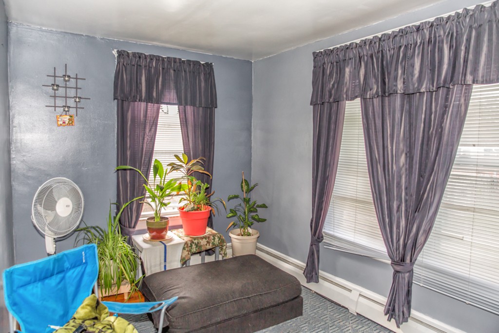101 Daviston Street Springfield, MA 01108 - Photo 20 of 25 a living room with furniture and a table