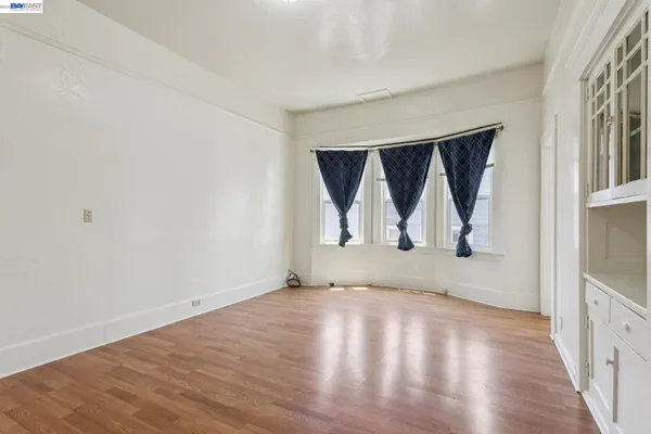 a kitchen with a refrigerator and a stove
