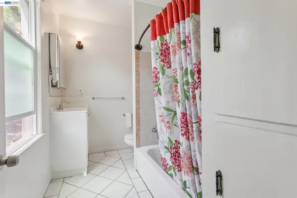 a bathroom with a bathtub and shower