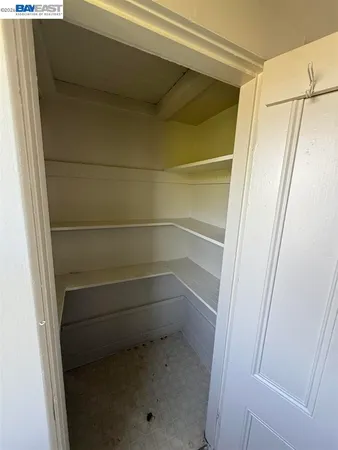 a kitchen with refrigerator a stove a microwave and window