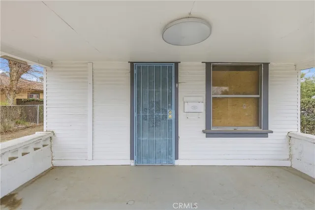 a bathroom with a granite countertop sink and a window