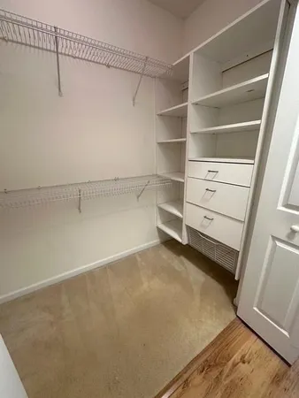 a view of a room with racks on the wall