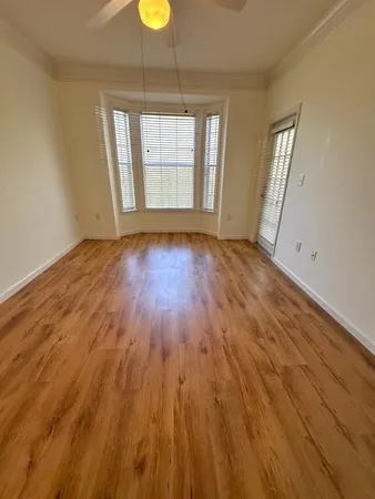 a view of a livingroom with wooden floor