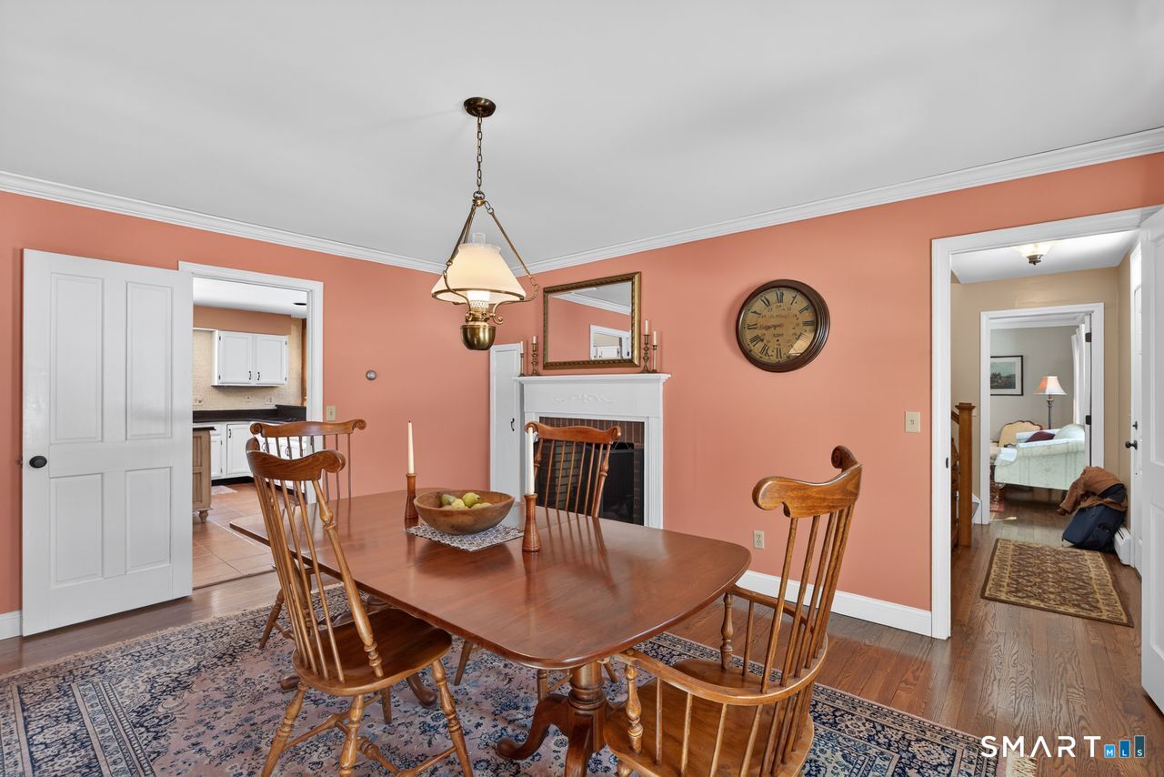 4 Hunters Ridge Road Killingworth, CT 06419 - Photo 12 of 40 a view of a dining room with furniture and a chandelier