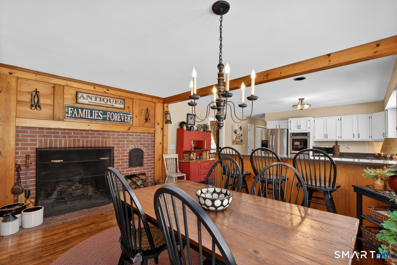 4 Hunters Ridge Road Killingworth, CT 06419 - Photo 18 of 40 a view of a dining room with furniture and wooden floor