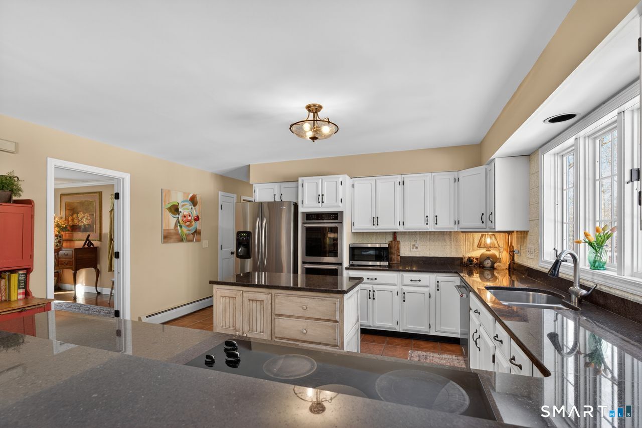 4 Hunters Ridge Road Killingworth, CT 06419 - Photo 21 of 40 a view of kitchen with stainless steel appliances granite countertop a sink stove top oven and cabinets