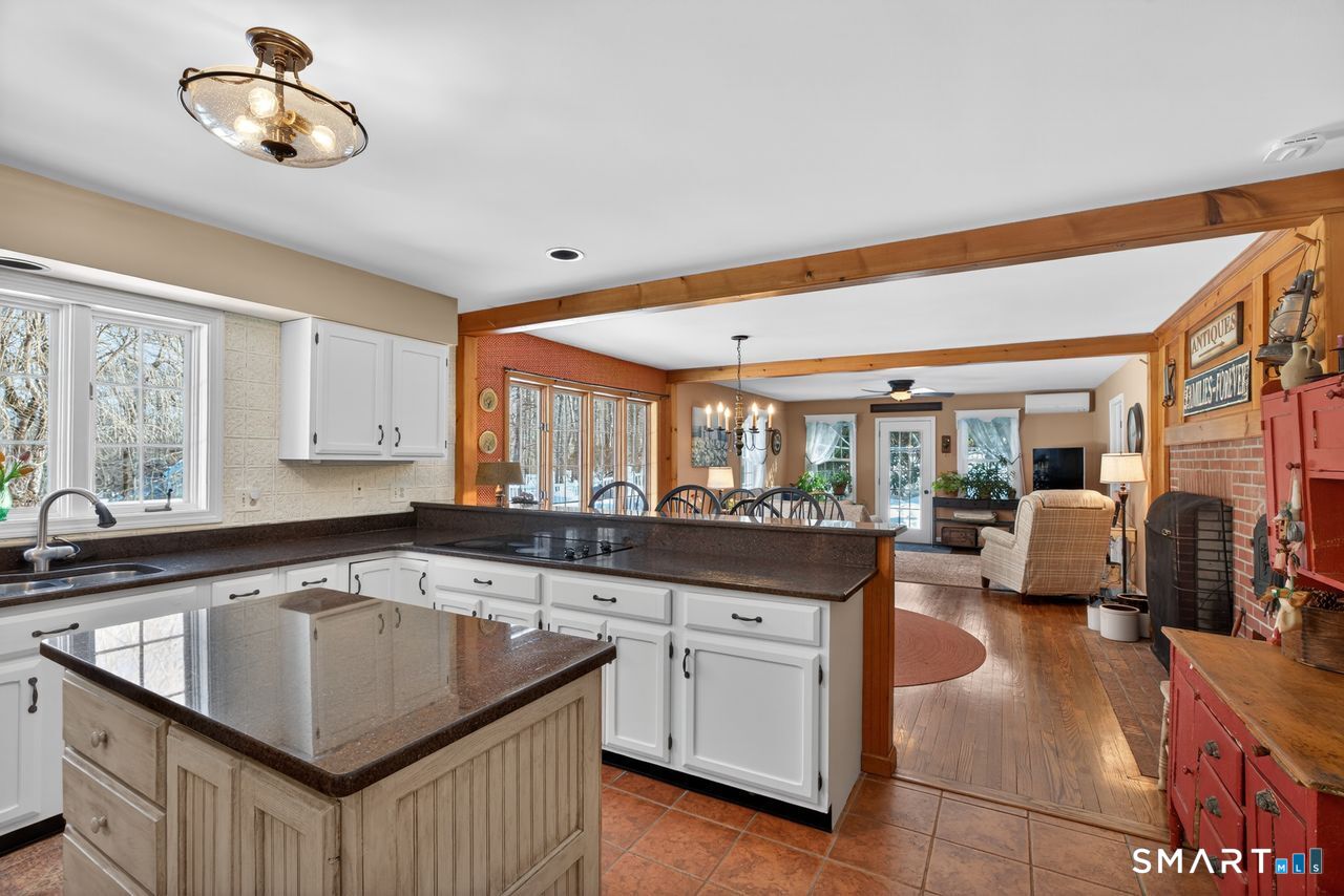 4 Hunters Ridge Road Killingworth, CT 06419 - Photo 24 of 40 a kitchen with a stove a sink and a refrigerator