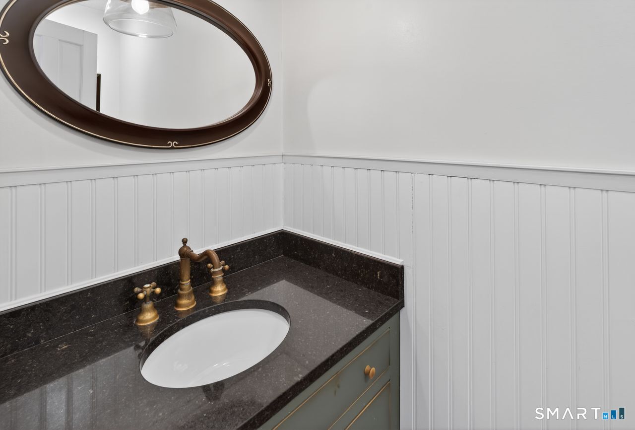 4 Hunters Ridge Road Killingworth, CT 06419 - Photo 25 of 40 a bathroom with a sink and a mirror