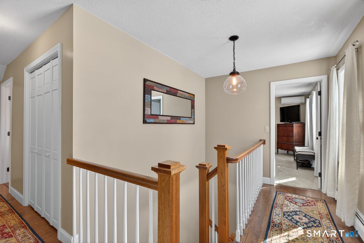 4 Hunters Ridge Road Killingworth, CT 06419 - Photo 28 of 40 a view of a hallway with a livingroom