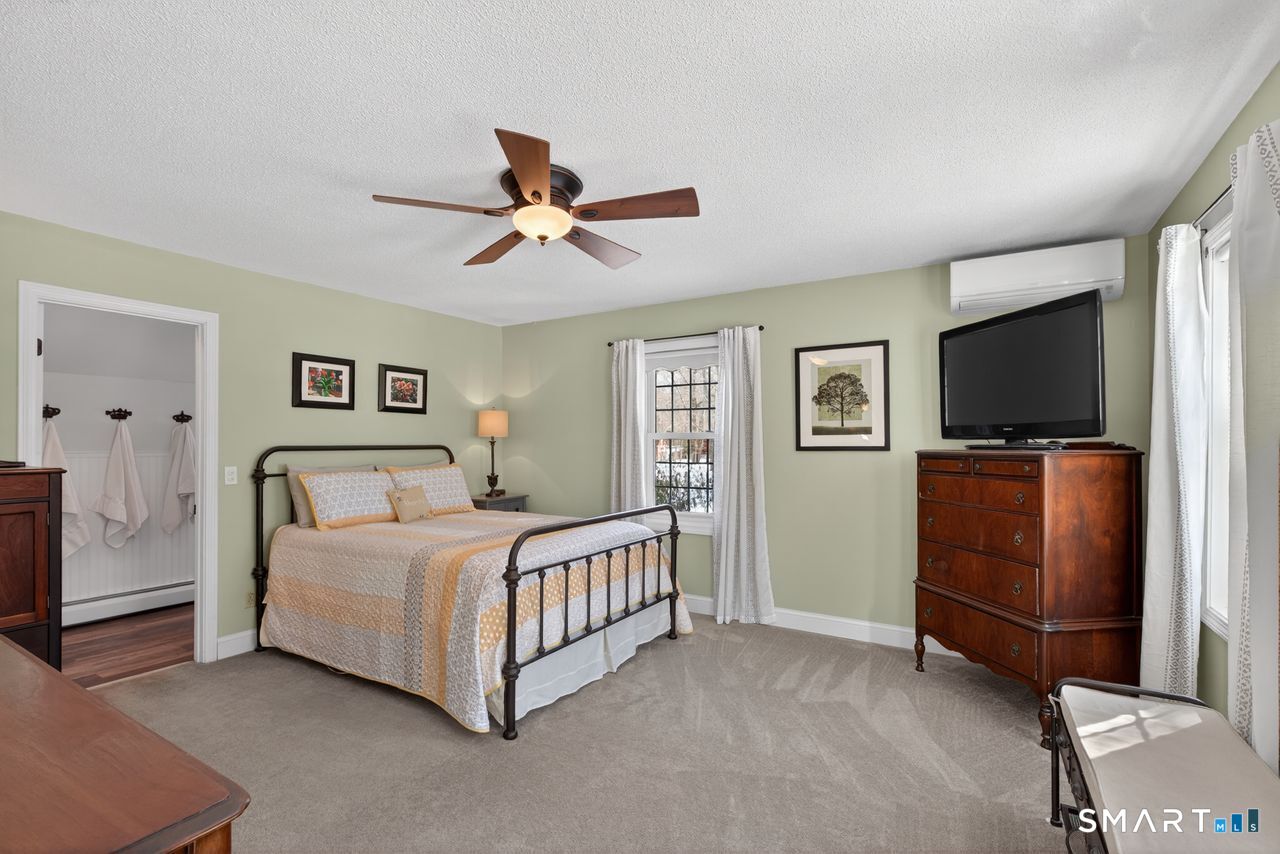 4 Hunters Ridge Road Killingworth, CT 06419 - Photo 29 of 40 a bedroom with a bed and a flat screen tv