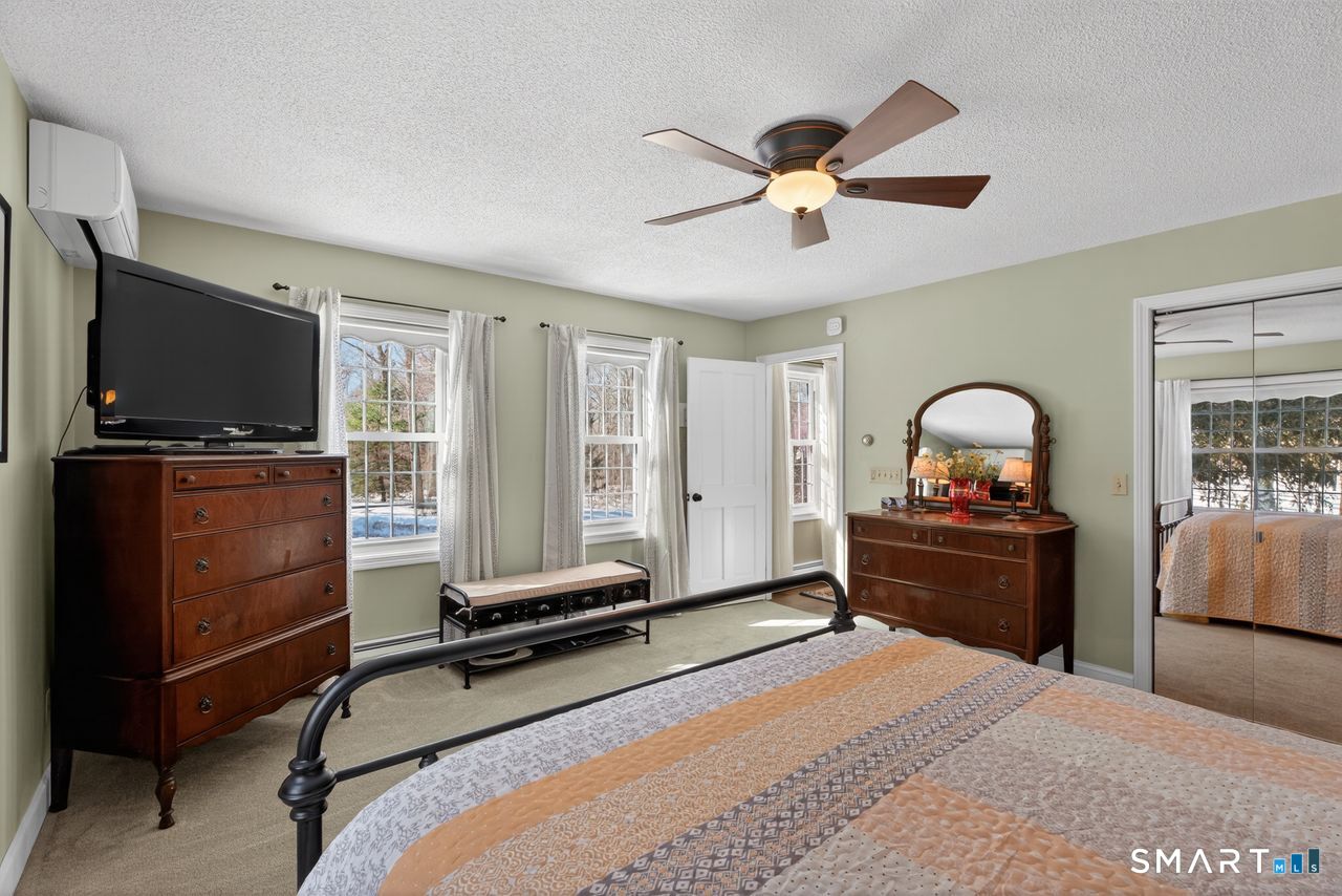 4 Hunters Ridge Road Killingworth, CT 06419 - Photo 31 of 40 a bedroom with a bed and a flat screen tv