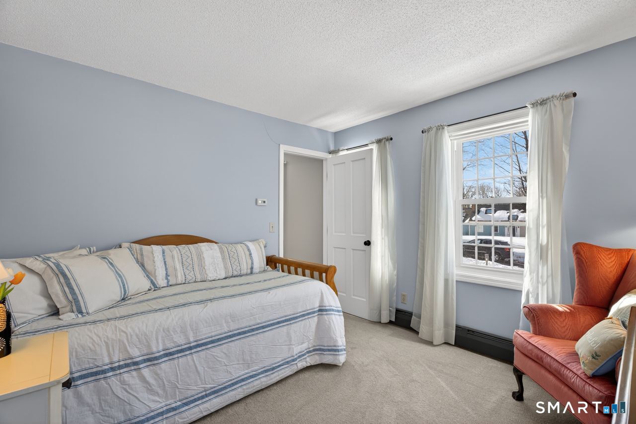 4 Hunters Ridge Road Killingworth, CT 06419 - Photo 34 of 40 a bedroom with a bed and a couch