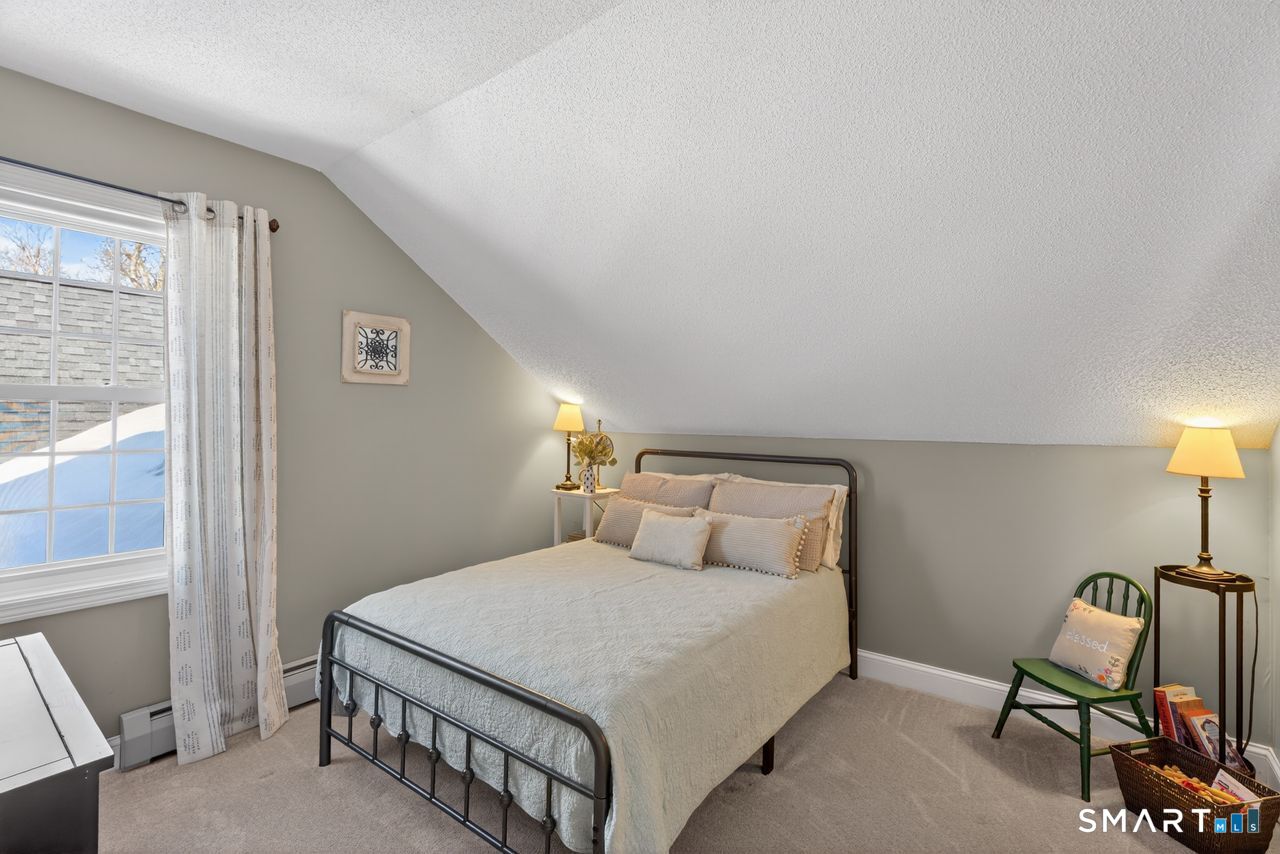 4 Hunters Ridge Road Killingworth, CT 06419 - Photo 36 of 40 a bedroom with a bed a lamp and a window