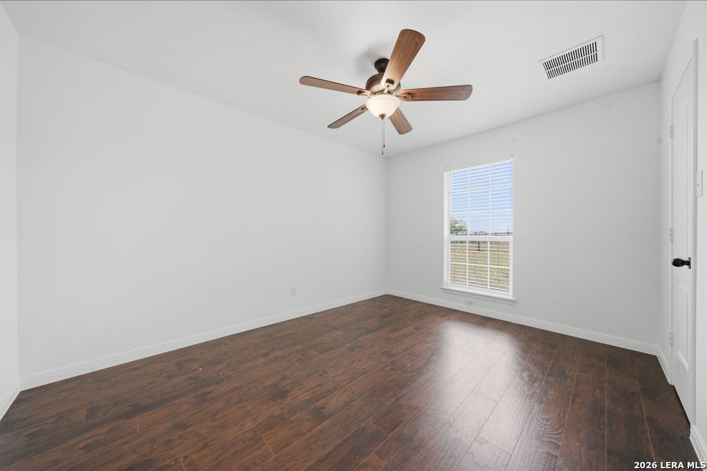 12897 La Vernia Road St. Hedwig, TX 78152 - Photo 24 of 34 a view of a livingroom with a hardwood floor and a ceiling fan