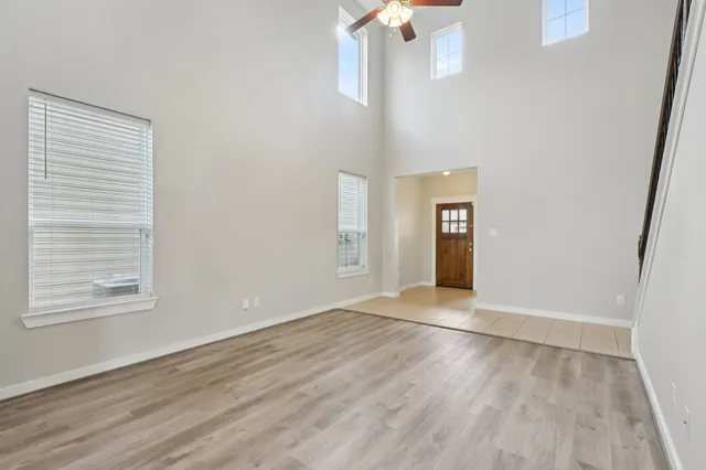 wooden floor in an empty room with a window