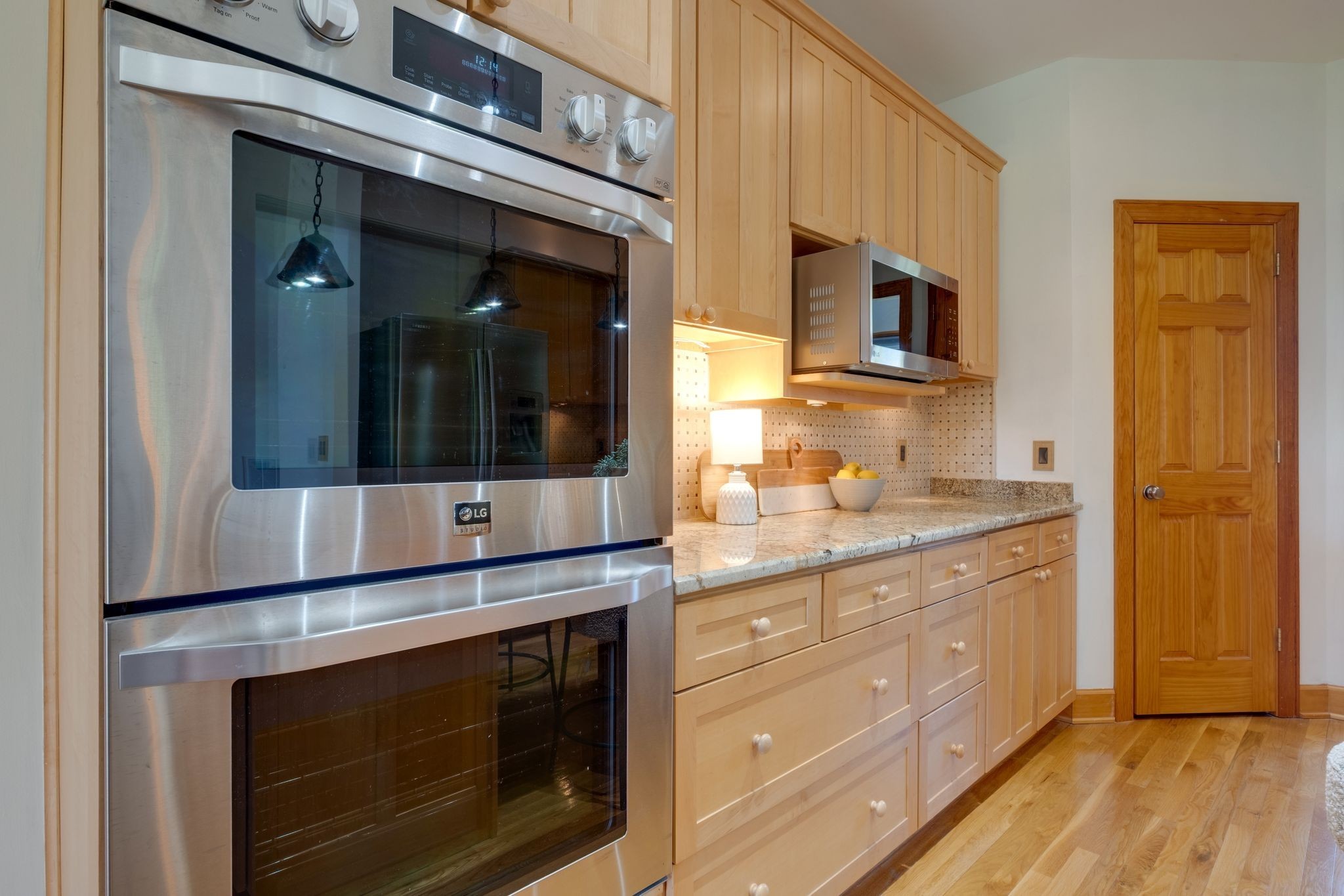 1249 White Road Bon Aqua, TN 37025 - Photo 14 of 60 a kitchen with stainless steel appliances granite countertop a stove microwave and cabinets
