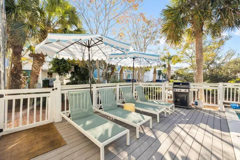 a view of a balcony with a table and chairs