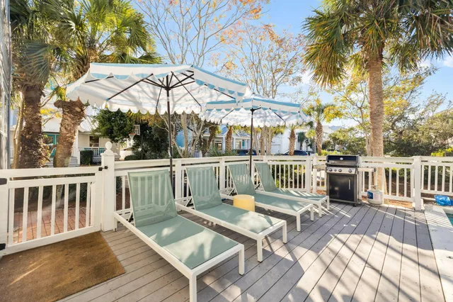 a view of a balcony with a table and chairs
