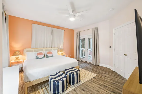 a bedroom with a bed and a flat screen tv
