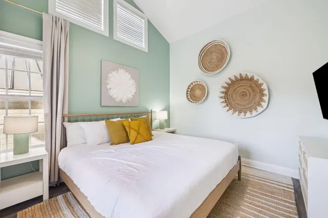 a bathroom with a sink a toilet and a large mirror