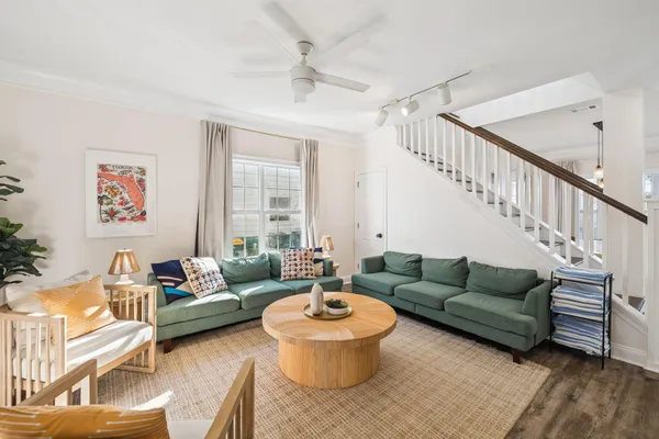 a kitchen with stainless steel appliances granite countertop a sink a stove a refrigerator a washer dryer and a dining table