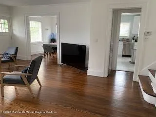 a view of a livingroom with furniture and wooden floor