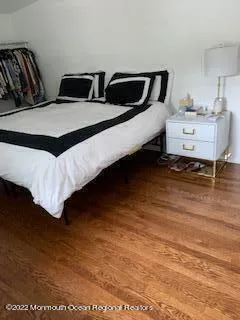 a bedroom with bed and window