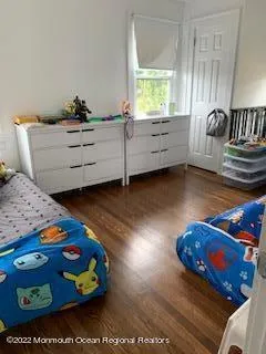 a bedroom with furniture and a window