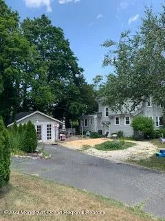 a house with trees in the background