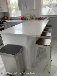a kitchen with a sink and a stove