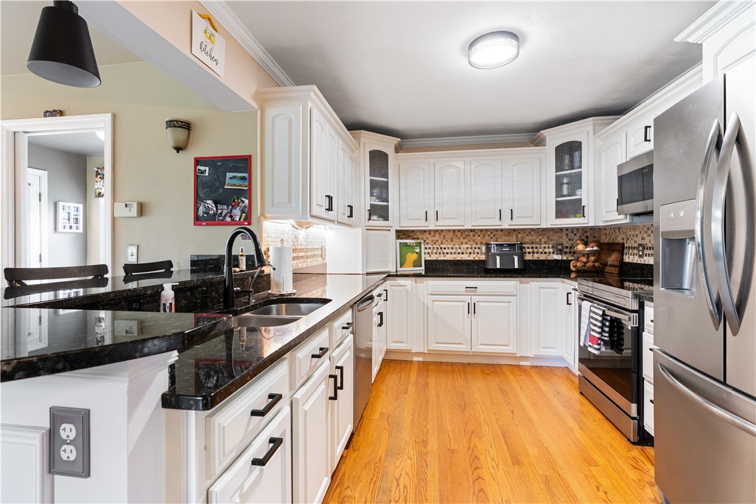 5 Victoria Lane Rehoboth, MA 02769 - Photo 9 of 48 The centered kitchen is the heart of the home.