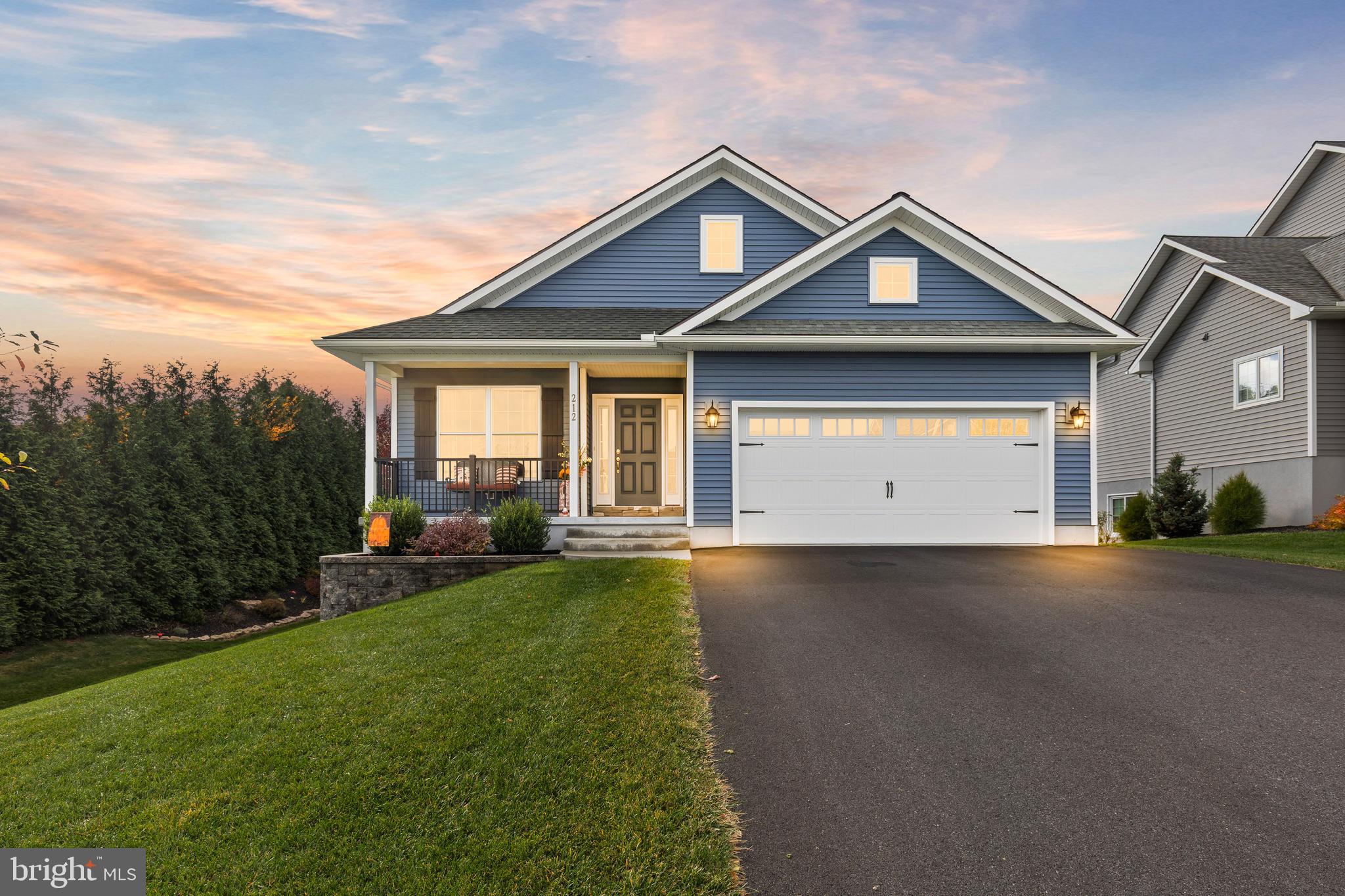 212 Scenic Ridge Boulevard Lebanon, PA 17042 - Photo 2 of 33 a front view of a house with a yard and garage