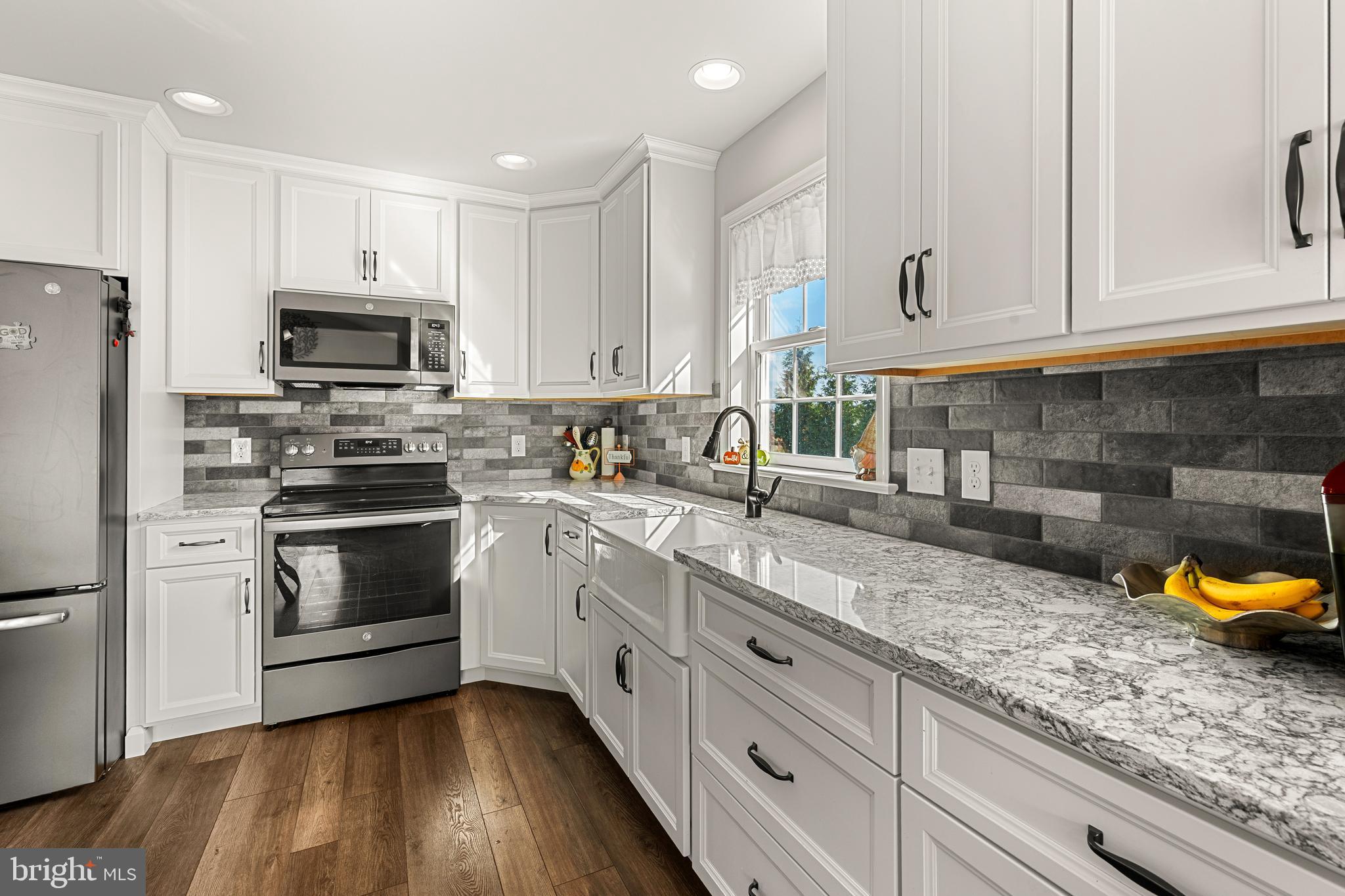 212 Scenic Ridge Boulevard Lebanon, PA 17042 - Photo 5 of 33 a kitchen with granite countertop a sink stainless steel appliances and cabinets