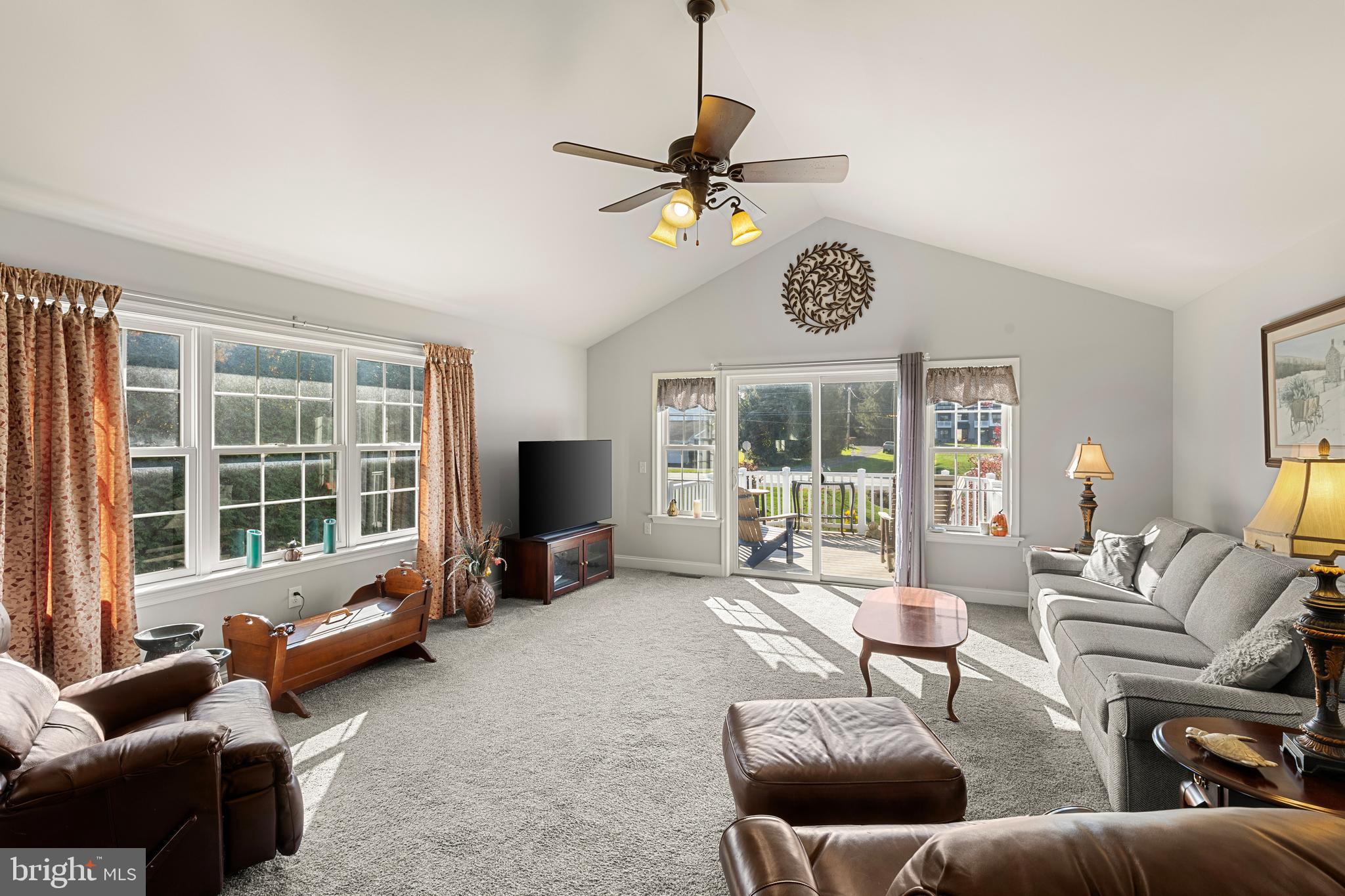 212 Scenic Ridge Boulevard Lebanon, PA 17042 - Photo 10 of 33 a living room with furniture a flat screen tv and a window
