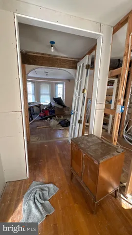 a living room with furniture window and a wooden floor