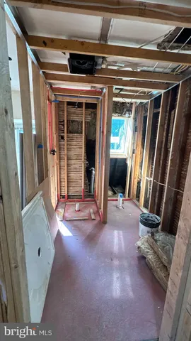 a view of a room with wooden floor and chair