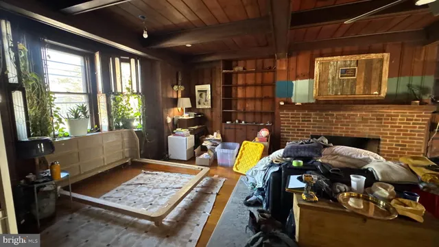 a view of workspace with wooden floor and windows