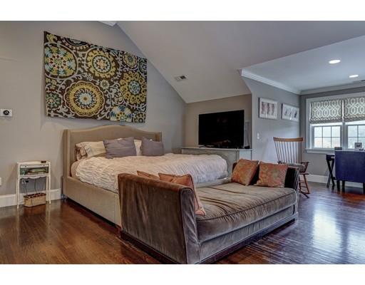 52 Baker Place Newton, MA 02462 - Photo 13 of 24 a bedroom with a large bed and a flat screen tv