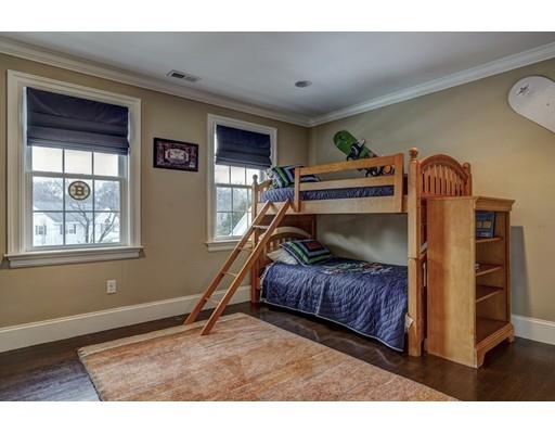 52 Baker Place Newton, MA 02462 - Photo 15 of 24 a bedroom with a bed and a window