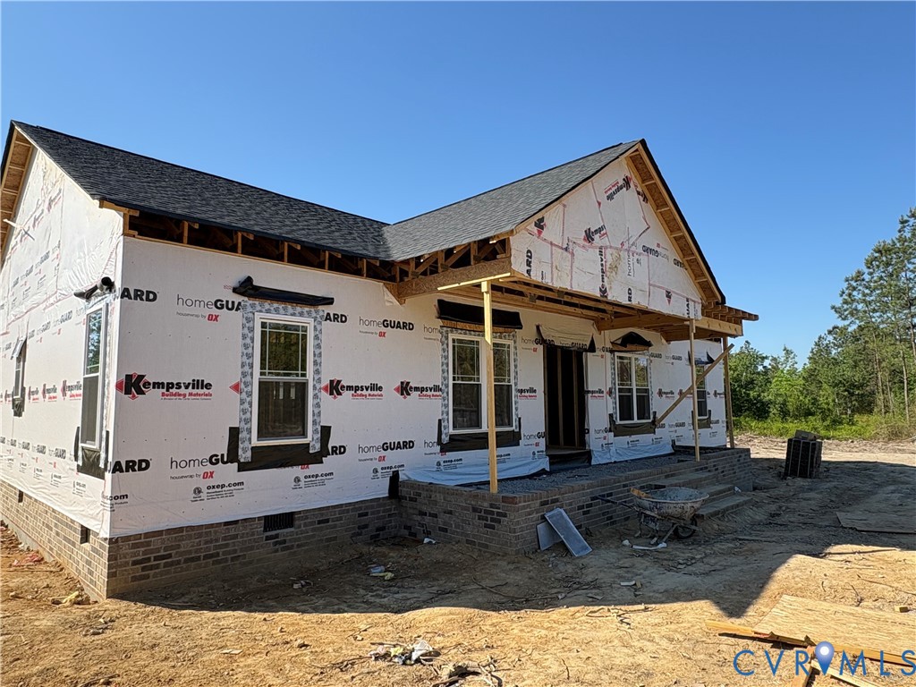 14915 Lebanon Road Disputanta, VA 23842 - Photo 3 of 6 a front view of a house with garden