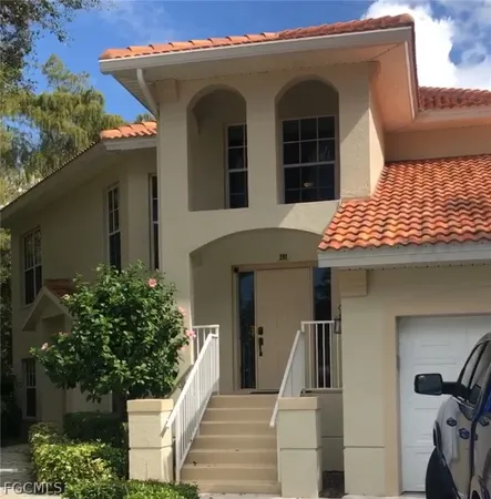 a view of a house with large windows