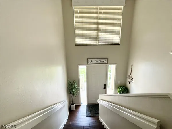 a view of hallway with wooden floor