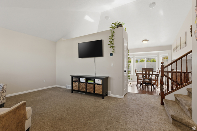 11189 Ohenry Road East Sandy, UT 84070 - Photo 5 of 44 Living area with vaulted ceilings and recessed lighting