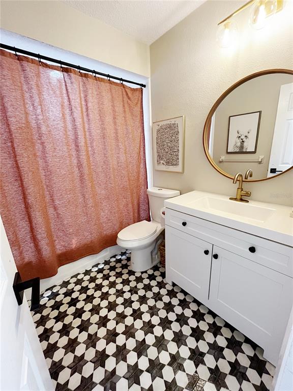 16 Raintree Court Ormond Beach, FL 32174 - Photo 12 of 37 a bathroom with a sink and a mirror