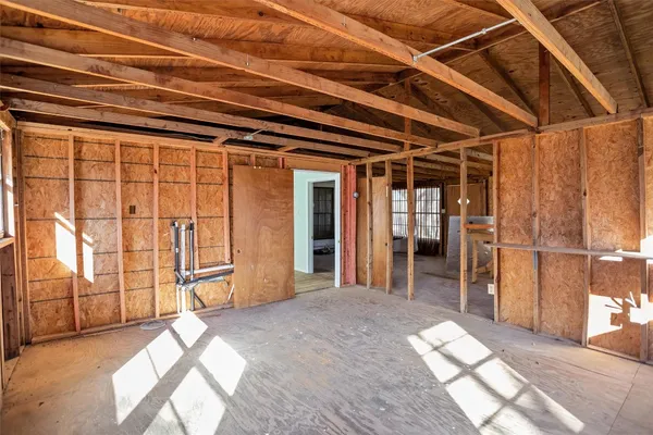 a view of empty room with wooden walls